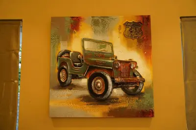 a painting of a jeep on a wall at Hotel PSY in Mettuppālaiyam