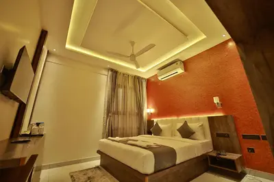 a bedroom with a large bed in a room at The Mysore Grand in Mysore
