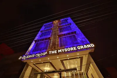 a building with blue lights on top of it at The Mysore Grand in Mysore