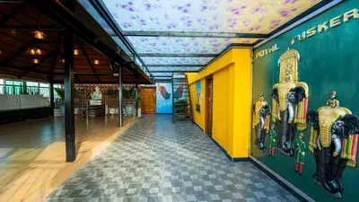 a hallway in a building with a ceiling at Royal Tusker Luxury Service Apartments in Mysore