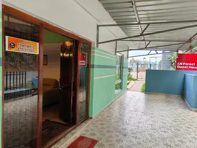 an open door of a building with a sign on it at Forest Gate only family in Ooty