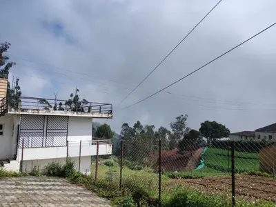 a group of people on top of a building at Forest Gate only family in Ooty