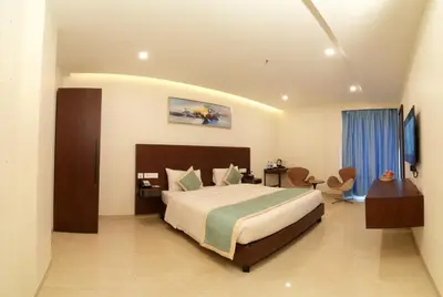 a bedroom with a large bed in a room at The Zen Park Coimbatore in Coimbatore