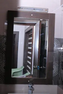 a mirror over a sink in a bathroom at Cloud Nine Kothagiri By Lexstays in Kotagiri