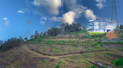 a house on top of a hill at Cloud Nine Kothagiri By Lexstays in Kotagiri