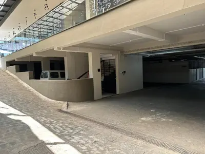 an empty building with a door and a stairway at Lantern Apart Hotel in Perintalmanna