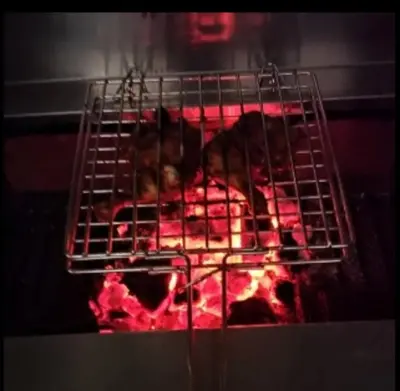 a rack of food cooking in an oven at Fortune Clio Resort in Periya