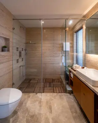 a bathroom with a shower and a toilet and a sink at Stays By MindEscapes in Ketti