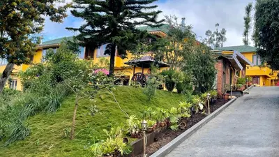 a house with plants on the side of a street at Habba Kadal Kashmiri Heritage Hotel & Hub in Coonoor