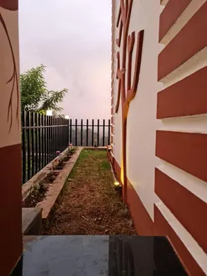 a hallway of a house with a fence at Sky Sketch in Kodaikānāl