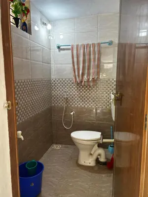 a small bathroom with a toilet in a room at 3 bedroom country home with a lush full backyard in Trichūr