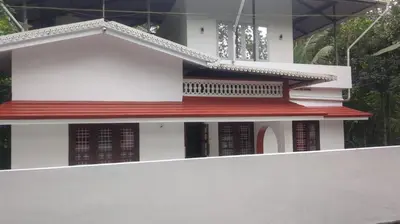 a model of a house with a red roof at 3 bedroom country home with a lush full backyard in Trichūr