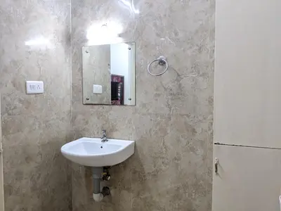 a bathroom with a sink and a mirror at Cherai Blue View Beach Resort in Cochin