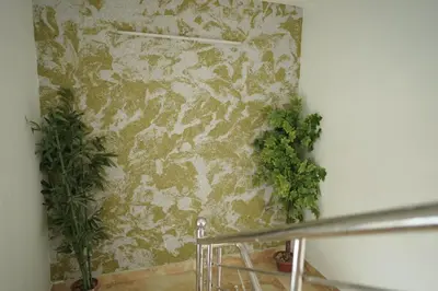 a room with a wall with plants on it at Cherai Blue View Beach Resort in Cochin