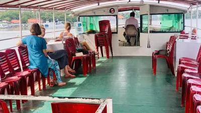 a group of people sitting on a bus at MAYPORT HERITREAT in Alwaye