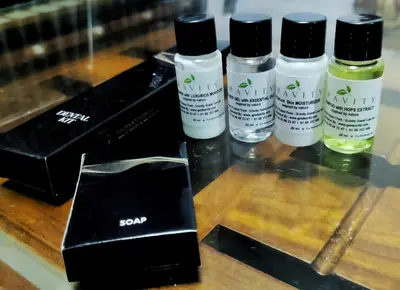four bottles of sony products sitting on a table at Raymond's Holiday Homes in Vythiri