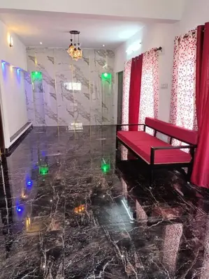a room with a red bench and a marble floor at Tea Estate view stay in Ooty