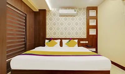a bedroom with a large bed in a room at Itsy Hotels Sapphire Residency in Manjeri