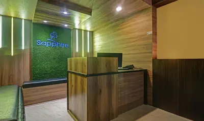an office with a desk and a sign on the wall at Itsy Hotels Sapphire Residency in Manjeri