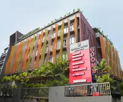 a building with a sign in front of it at Crystal Suites in Badagara