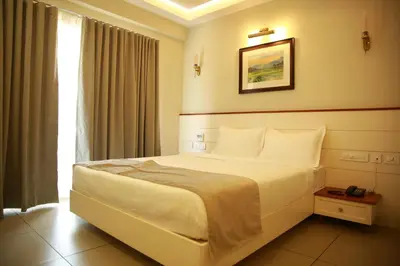 a bedroom with a large bed in a room at PEARL MAHE in Mahe
