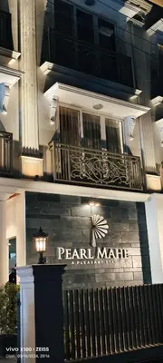 a sign on the front of a pearl marriott apartment building at PEARL MAHE in Mahe