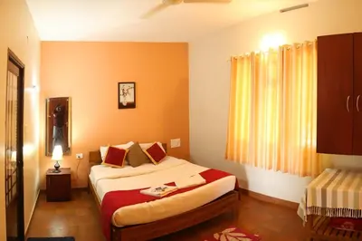 a bedroom with a large bed in a room at Karapuzha Water Scapes Wayanad in Wayanad