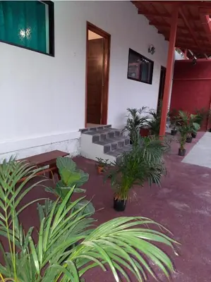 a courtyard with plants and stairs in a building at Coorg Happy Estate Stay in Madikeri