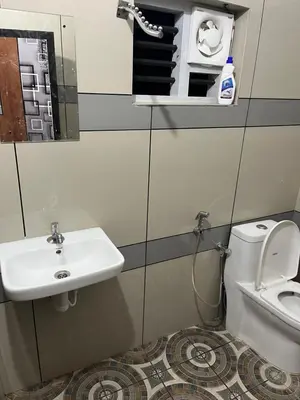 a bathroom with a sink and a toilet at HOLLYWOOD Villa in Sultan Bathery