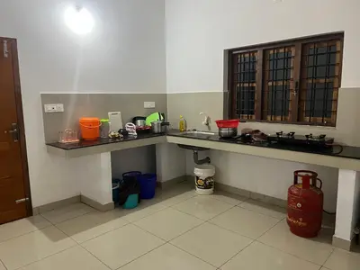 a kitchen with a sink and a counter top at HOLLYWOOD Villa in Sultan Bathery