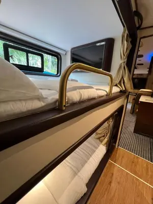 a couple of bunk beds in the back of a van at FRONTLINES CARAVAN in Kadikkād