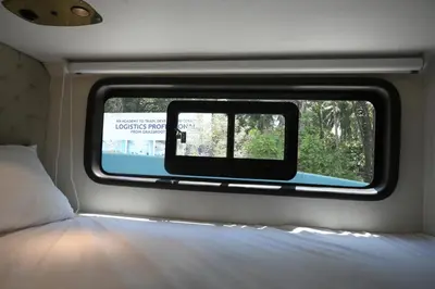 a view of a window in a train car at FRONTLINES CARAVAN in Kadikkād