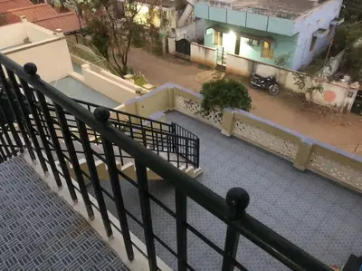 an overhead view of a building with a balcony at Single room Homestay Second floor in Palani