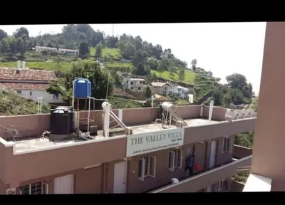 a building with a sign that reads the winter way at The Valley Villa in Kotagiri