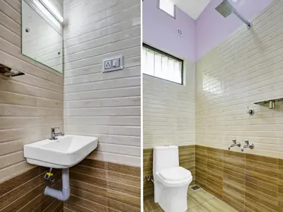 a bathroom with a sink and a toilet at Shalom Palace Residency in Neriyamangalam