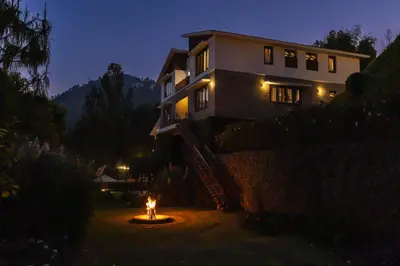 a fire hydrant in front of a house at night at Dvara Luxury Resort Kodaikanal in Kodaikānāl