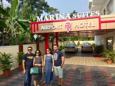 a group of people standing in front of a hotel at MARINA SUITES AIRPORT HOTEL in Cochin