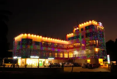 a lit up building with christmas lights on it at The Rosetta Castle in Kalpetta