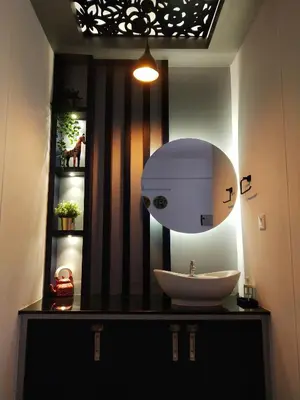 a bathroom with a sink and a large mirror at Casa Maria Mystica apartments, Mananthavady, Wayanad in Mānantoddy