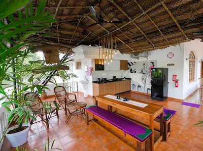 a kitchen and dining room with a table and chairs at Parudeesa - Heavenly- Luxurious Palace look-Near CBD - Kerala - India with Breakfast in Kāladi