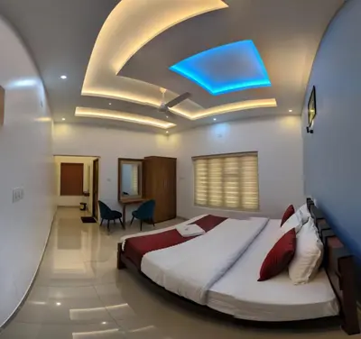 a hotel room with a bed and a blue ceiling at SILVERY MOON Resort in Tariyod