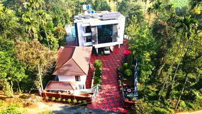 an aerial view of a house in the middle of a forest at SILVERY MOON Resort in Tariyod