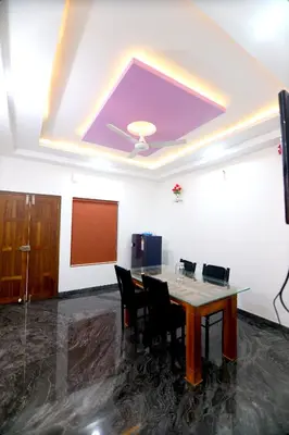 a conference room with a table and chairs and a screen at SILVERY MOON Resort in Tariyod