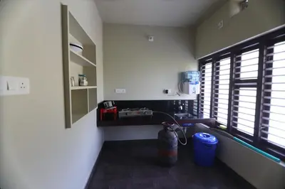 a bathroom with a sink and a window in a room at SILVERY MOON Resort in Tariyod