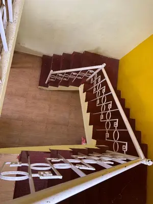a staircase in a room with at Wander homes in Ooty