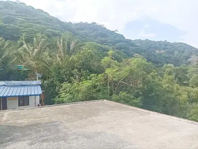 a view of a mountain from the roof of a house at BHASURI VILLA Attappady in Varagampadi