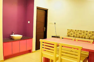 a bathroom with a sink and a counter with a bowl on it at Mist Wayanad in Wayanad