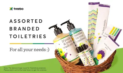 a basket ofented branded toothbrushes and cosmetics at Treebo Regalia Inn Wayanad With Swimming Pool in Kalpetta