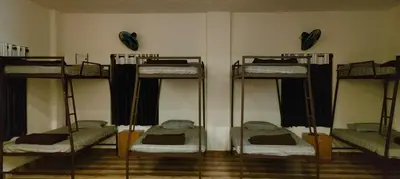a room with four bunk beds in a room at The Lavender Woods in Vythiri
