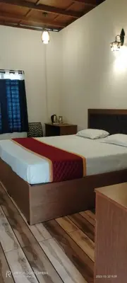 a bedroom with a large bed in a room at The Lavender Woods in Vythiri